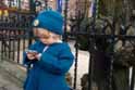 Child in blue with phone